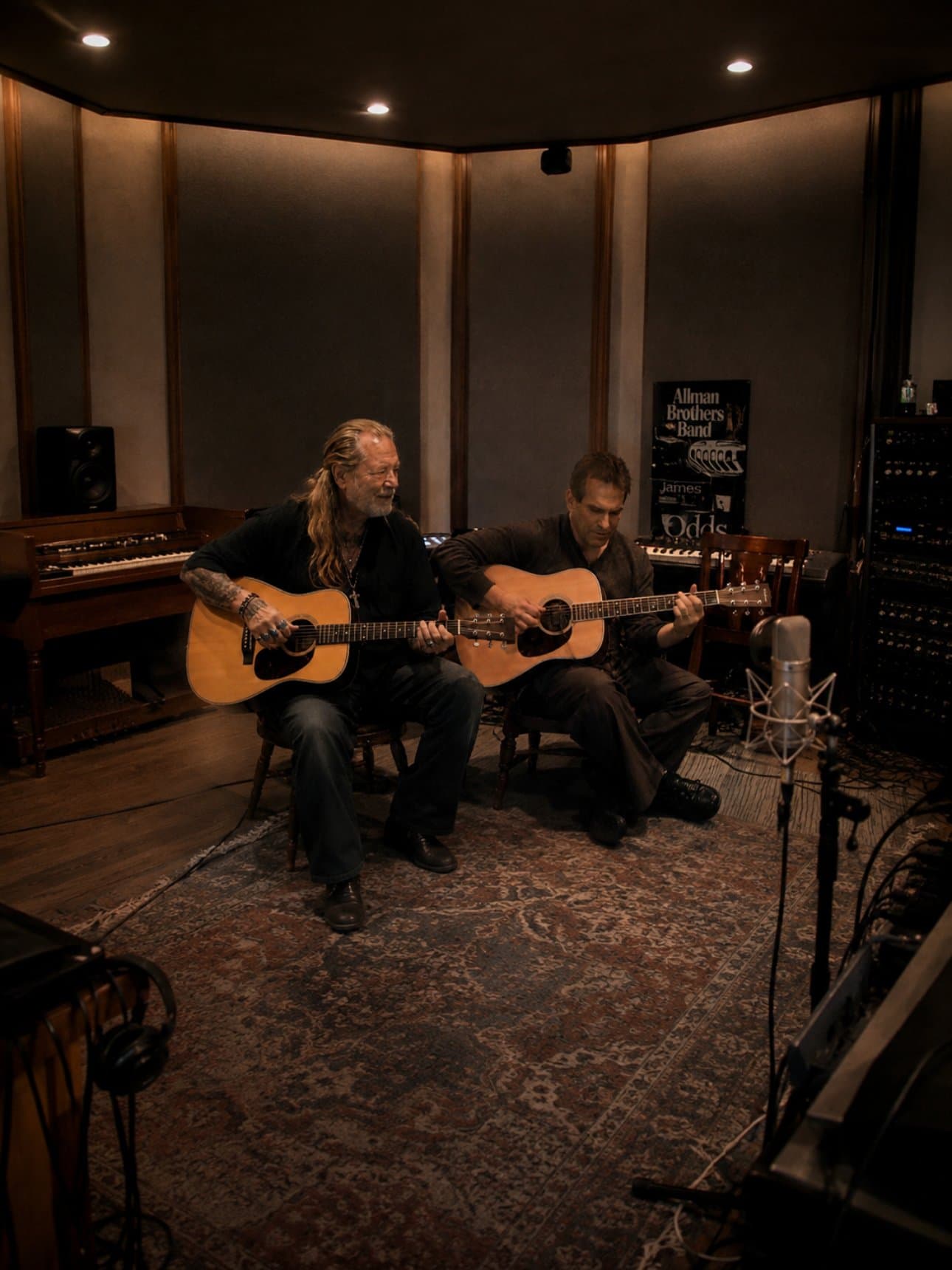 Mark DiPietro and Gregg Allman recording acoustic guitars side by side in the studio, Georgia 2013