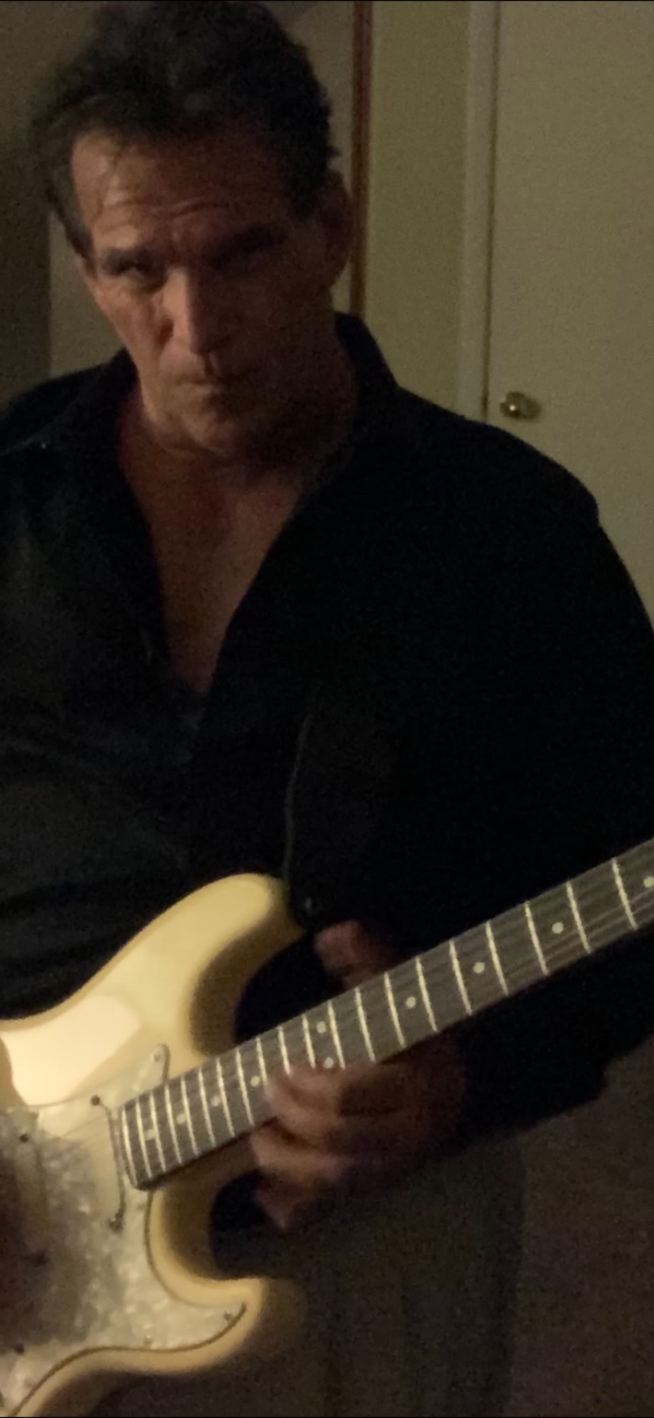 Mark Allen DiPietro performing with his electric guitar